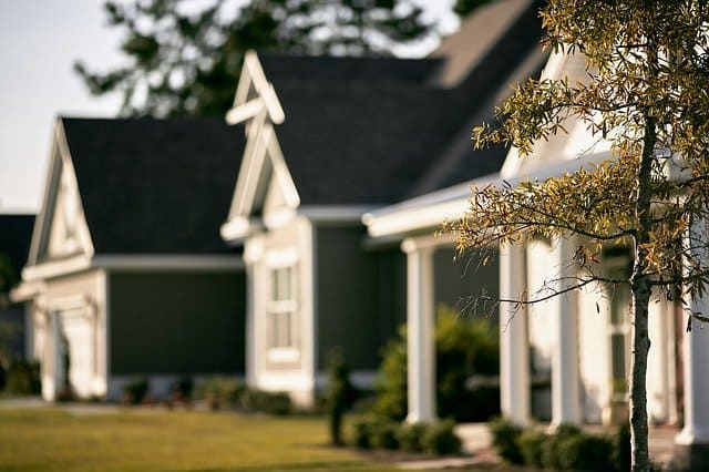 Homes with front porches and lawns in a residential neighborhood