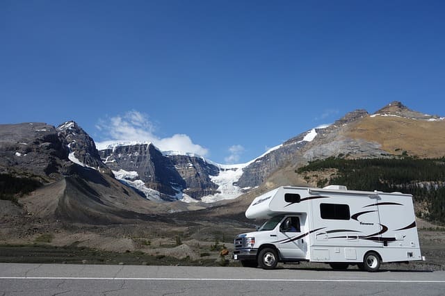 A motorhome parked beside a mountain road
